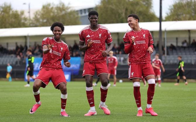 UEFA Youth League - Liverpool U18 v Atletico Madrid U18 LIVERPOOL, ENGLAND, SEPTEMBER 9: GOAL 1-0, Mor Talla Ndiaye of Liverpool goal celebration with Alvin Ayman & Josh Sonni-Lambie of Liverpool after scoring a goal to put Liverpool U18 1-0 ahead during The UEFA Youth League match between Liverpool U18 v Atletico Madrid U18 at Liverpool FC Academy Ground, Liverpool, England, on September 9. (Photo by Daniel Weir) Liverpool Liverpool Academy Ground England Copyright: xDanielxWeir SportsxPressxPhotox Sportspressphoto_SPR226787