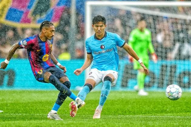 BARCELONA , 09-09-2026 , Spotify Camp Nou , season 2026 2027 , UEFA Champions League football , match between FC Barcelona, Barca and Feyenoord Rotterdam , picture shows Feyenoord player Tsuyoshi Watanabe and FC Barcelona player Raphinha Barcelona - Feyenoord  x206776649x Copyright: