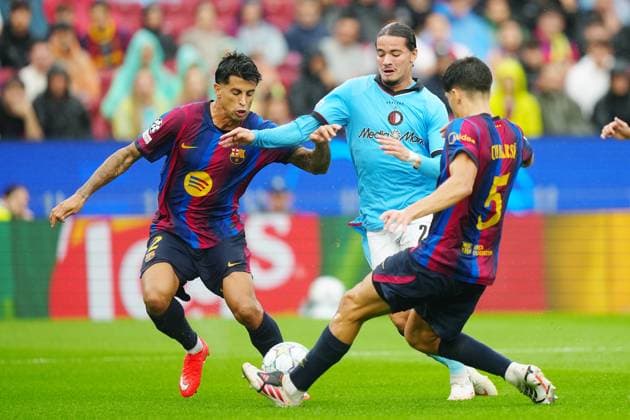 BARCELONA , 09-09-2026 , Spotify Camp Nou , season 2026 2027 , UEFA Champions League football , match between FC Barcelona, Barca and Feyenoord Rotterdam , picture shows Feyenoord player Anis Hadj Moussa, FC Barcelona player Pau Cubarsi (R) and FC Barcelona player Joao Cancelo (L) Barcelona - Feyenoord  x206777123x Copyright: