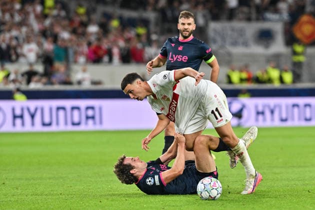 STUTTGART, GERMANY; 09. SEPTEMBER: tackle between Bilal EL KHANNOUSS (VfB Stuttgart 11) and Joe BELL (Viking FK 8) during the Champions League Match between VfB Stuttgart vs. Viking FK at Matchday 1 at MHP-Arena Copyright: xBEAUTIFULxSPORTS Goldbergx