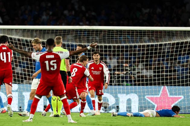 Martin Odegaard of Arsenal celebrates with team mates after scoring the goal of 0-1 during the UEFA Champions League 2026 2027 football match between SSC Napoli and Arsenal FC at Diego Armando Maradona stadium in Naples, (Italy), September 9, 2026. cesarexpurini