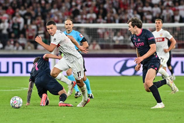 STUTTGART, GERMANY; 09. SEPTEMBER: tackle between Bilal EL KHANNOUSS (VfB Stuttgart 11) and Joe BELL (Viking FK 8) during the Champions League Match between VfB Stuttgart vs. Viking FK at Matchday 1 at MHP-Arena Copyright: xBEAUTIFULxSPORTS Goldbergx