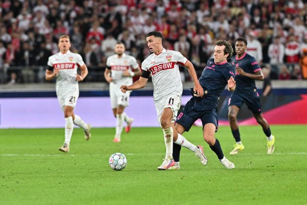 STUTTGART, GERMANY; 09. SEPTEMBER: tackle between Bilal EL KHANNOUSS (VfB Stuttgart 11) and Joe BELL (Viking FK 8) during the Champions League Match between VfB Stuttgart vs. Viking FK at Matchday 1 at MHP-Arena Copyright: xBEAUTIFULxSPORTS Goldbergx