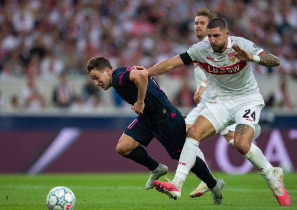 Zlatko Tripic of Viking fights for the ball with Julian Chabot of Stuttgart during UEFA Champions League - Matchday 1 season 26 27 game between Stuttgart and Viking (Ruslan Taran Ball Raw Images) Stuttgart MHP Arena Germany Copyright: xRuslanxTaranx RUS_STUTT-VIKING-0204