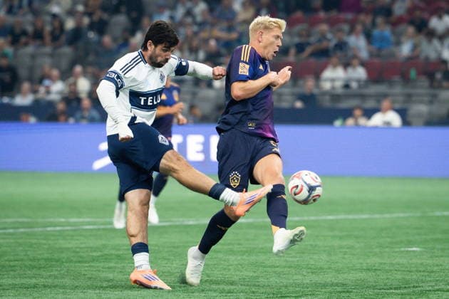 September 9, 2026, Vancouver, Bc, CANADA: Vancouver Whitecaps Brian White (left) kicks the ball to score as Los Angeles Galaxy s Jakob Glesnes (5) defends during the first half of an MLS, Fussball Herren, USA soccer match in Vancouver on Wednesday, Sept. 9, 2026. Canada News - September 9, 2026  - ZUMAc35_ 20260909_zaf_c35_172 Copyright: xEthanxCairnsx