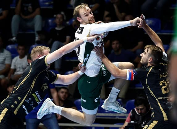 Partizan v Fuchse Berlin - EHF Champions League Mathias Gidsel (C) of Fuchse Berlin in action against Ivan Micic (R) and Sergei Ivanov (L) of Partizan during the EHF Champions League Season 2026 2027 Group Phase match between RK Partizan v Fuchse Berlin at Aleksandar Nikolic Hall on September 10, 2026 in Belgrade, Serbia. Belgrade Serbia Copyright: xSrdjanxStevanovicx x