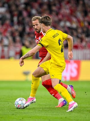 Harry Kane (FC Bayern Muenchen) and Villads Nielsen (FK Bodo Glimt) battle for the ball during the UEFA Champions League 2026 2027 match between Bayern Muenchen and Bodo Glimt at Fussball Arena Muenchen on September 10, 2026 in Munich, Germany. (Photo by Harry Langer DeFodi Images) -