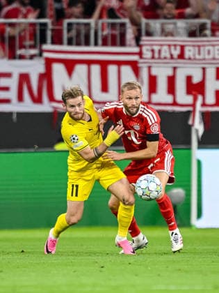 Ole Didrik Blomberg (FK Bodo Glimt) and Konrad Laimer (FC Bayern Muenchen) battle for the ball during the UEFA Champions League 2026 2027 match between Bayern Muenchen and Bodo Glimt at Fussball Arena Muenchen on September 10, 2026 in Munich, Germany. (Photo by Harry Langer DeFodi Images) -
