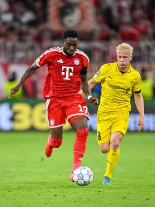 Alphonso Davies (FC Bayern Muenchen) and Sondre Auklend (FK Bodo Glimt) battle for the ball during the UEFA Champions League 2026 2027 match between Bayern Muenchen and Bodo Glimt at Fussball Arena Muenchen on September 10, 2026 in Munich, Germany. (Photo by Harry Langer DeFodi Images) -