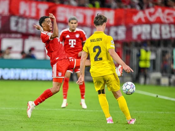 Jamal Musiala (FC Bayern Muenchen) and Villads Nielsen (FK Bodo Glimt) battle for the ball during the UEFA Champions League 2026 2027 match between Bayern Muenchen and Bodo Glimt at Fussball Arena Muenchen on September 10, 2026 in Munich, Germany. (Photo by Harry Langer DeFodi Images) -
