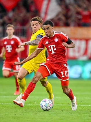 Patrick Berg (FK Bodo Glimt) and Jamal Musiala (FC Bayern Muenchen) battle for the ball during the UEFA Champions League 2026 2027 match between Bayern Muenchen and Bodo Glimt at Fussball Arena Muenchen on September 10, 2026 in Munich, Germany. (Photo by Harry Langer DeFodi Images) -