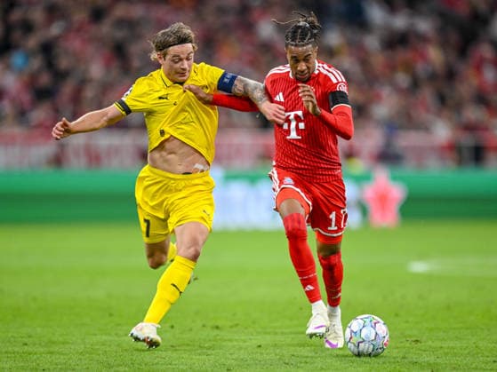 Patrick Berg (FK Bodo Glimt) and Michael Olise (FC Bayern Muenchen) battle for the ball during the UEFA Champions League 2026 2027 match between Bayern Muenchen and Bodo Glimt at Fussball Arena Muenchen on September 10, 2026 in Munich, Germany. (Photo by Harry Langer DeFodi Images) -
