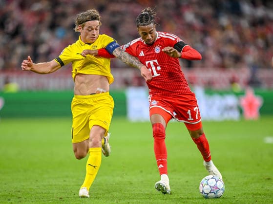 Patrick Berg (FK Bodo Glimt) and Michael Olise (FC Bayern Muenchen) battle for the ball during the UEFA Champions League 2026 2027 match between Bayern Muenchen and Bodo Glimt at Fussball Arena Muenchen on September 10, 2026 in Munich, Germany. (Photo by Harry Langer DeFodi Images) -