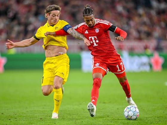 Patrick Berg (FK Bodo Glimt) and Michael Olise (FC Bayern Muenchen) battle for the ball during the UEFA Champions League 2026 2027 match between Bayern Muenchen and Bodo Glimt at Fussball Arena Muenchen on September 10, 2026 in Munich, Germany. (Photo by Harry Langer DeFodi Images) -