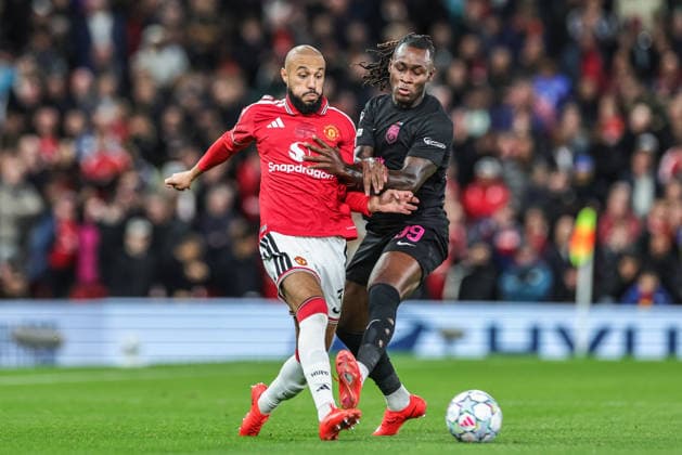 UEFA Champions League Matchday 1 of 8 Manchester United, ManU v Sabah FK Noussair Mazraoui of Manchester United passes the ball under pressure from OrphÃ Mbina of Sabah FK during the UEFA Champions League Matchday 1 of 8 match Manchester United vs Sabah FK at Old Trafford, Manchester, United Kingdom on 10 September 2026 (Photo by Mark Cosgrove News Images) Manchester Old Trafford Greater Manchester United Kingdom Copyright: xMarkxCosgrove NewsxImagesx