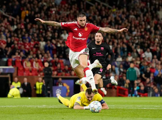 Manchester, England, 10th September 2026. Benjamin Sesko of Manchester United, ManU goes past Stas Pokatilov of Sabah FC to score the third goal during the Manchester United vs Sabah UEFA Champions League match at Old Trafford, Manchester. Picture credit should read: Andrew Yates Sportimage EDITORIAL USE ONLY. No use with unauthorised audio, video, data, fixture lists, club league logos or live services. Online in-match use limited to 120 images, no video emulation. No use in betting, games or single club league player publications. SPI_043_AY_Man_Utd_Sabah SPI-4989-0043