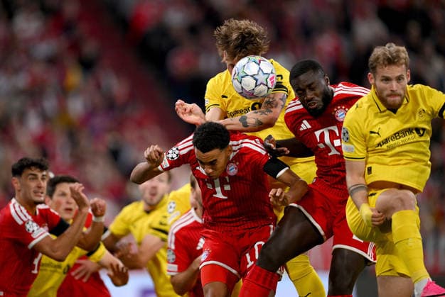FUSSBALL CHAMPIONS LEAGUE SAISON 2026 2027 Vorrunde 1. Spieltag 10.09.2026 FC Bayern Muenchen - FK Bodoe Glimt v. li., Jamal Musiala (FC Bayern Muenchen) gegen Andreas Helmersen (FK Bodoe Glimt) gegen Dayot Upamecano (FC Bayern Muenchen) gegen Ole Didrik Blomberg (FK Bodoe Glimt)