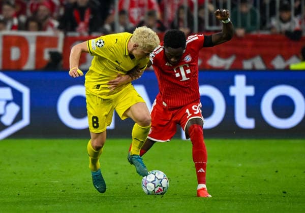 10.09.2026, xemx, Fussball UEFA Champions League, FC Bayern Muenchen - FK Bodö Glimt v.l. Sondre Auklend (FK Bodö Glimt), Alphonso Davies (FC Bayern Muenchen) Zweikampf, Aktion, action, battle for the ball Muenchen