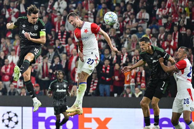 Florian Thauvin of Lens, left, scores a goal during the Football Champions League opening round match Slavia Prague vs RC Lens on September 10, 2026, in Prague, Czech Republic. 2nd left is Tomas Vlcek of Slavia. (CTKxPhoto VitxSimanek) CTKPhotoP2026091010863  CTKPhotoP2026091010863