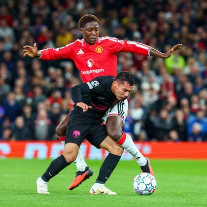 RECORD DATE NOT STATED 10th September 2026; Old Trafford, Manchester, England; UEFA Champions League Football, Manchester United, ManU versus Sabah; Umarali Rakhmonaliev of Sabah FK shields the ball from Kobbie Mainoo of Manchester United RogerxEvans