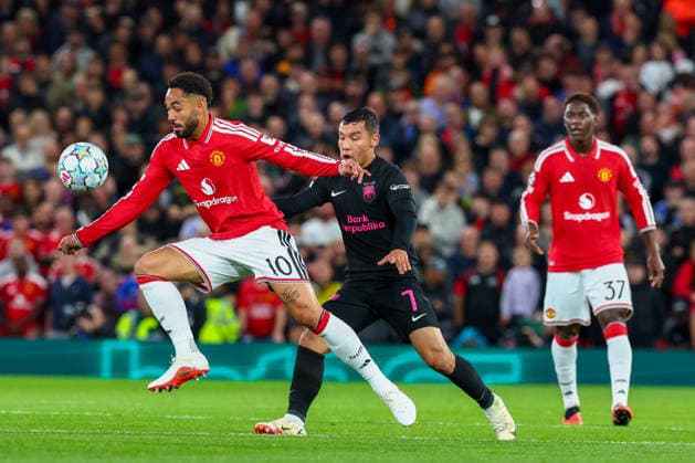 RECORD DATE NOT STATED 10th September 2026; Old Trafford, Manchester, England; UEFA Champions League Football, Manchester United, ManU versus Sabah; Matheus Cunha of Manchester United spins around Umarali Rakhmonaliev of Sabah FK RogerxEvans