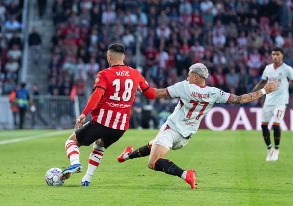 Gleiker Mendoza of FC Shakhtar Donetsk makes a slide tackle on Filip Kostic of PSV Eindhoven during UEFA Champions League - Matchday 1 - PSV Eindhoven vs FC Shakhtar Donetsk (Ruslan Taran Ball Raw Images) Eindhoven Philips Stadion Netherlands Copyright: xRuslanxTaranx RUS_PSV-SHA-0252