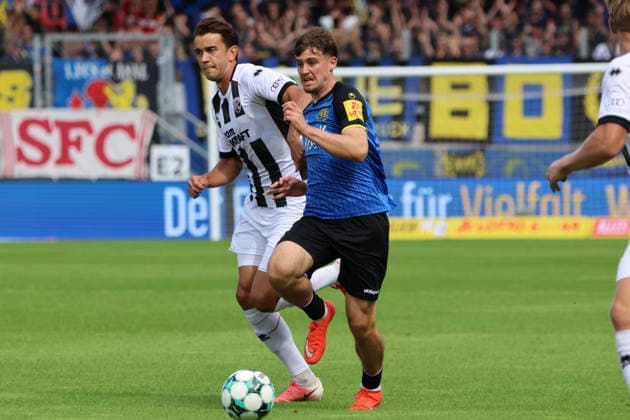 12.09.2026, Fussball, Herren, 3. Liga, Saison 2026 2027, 1. FC Saarbrücken - FC Ingolstadt 04, Alexander Staff (1. FC Saarbrücken), Fredrik Carlsen (FC Ingolstadt 04) Saarbrücken Ludwigsparkstadion Saarland Deutschland (DEU) Copyright: xSebastianxBachx