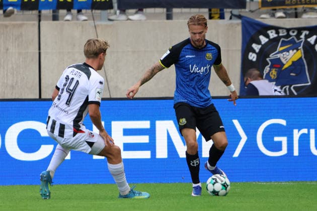 12.09.2026, Fussball, Herren, 3. Liga, Saison 2026 2027, 1. FC Saarbrücken - FC Ingolstadt 04, Niko Bretschneider (1. FC Saarbrücken), Max Plath (FC Ingolstadt 04) Saarbrücken Ludwigsparkstadion Saarland Deutschland (DEU) Copyright: xSebastianxBachx