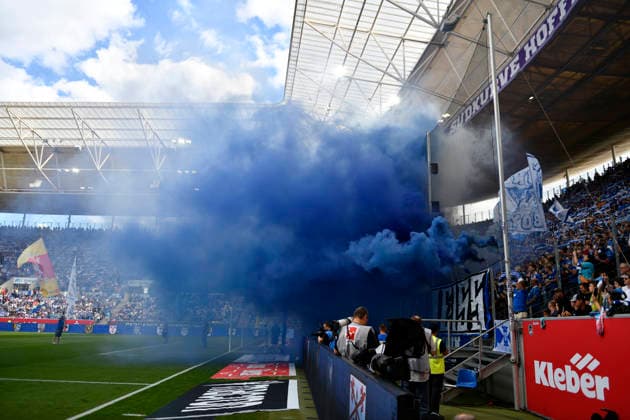 vor Spielbeginn: Bengalos, Pyrotechnik, Pyro, Feuerwerkskoerper, Fanblock TSG 1899 Hoffenheim blauer Rauch TSG 1899 Hoffenheim vs VfB Stuttgart 12.09.2026 DFL REGULATIONS PROHIBIT ANY USE OF PHOTOGRAPHS AS IMAGE SEQUENCES AND OR QUASI-VIDEO TSG 1899 Hoffenheim vs VfB Stuttgart *** Before the start of the game: flares, pyrotechnics, fireworks, TSG 1899 Hoffenheim fan section—blue smoke—TSG 1899 Hoffenheim vs. VfB Stuttgart, September 12, 2026. DFL regulations prohibit any use of photographs as image sequences and or quasi-video. TSG 1899 Hoffenheim vs. VfB Stuttgart