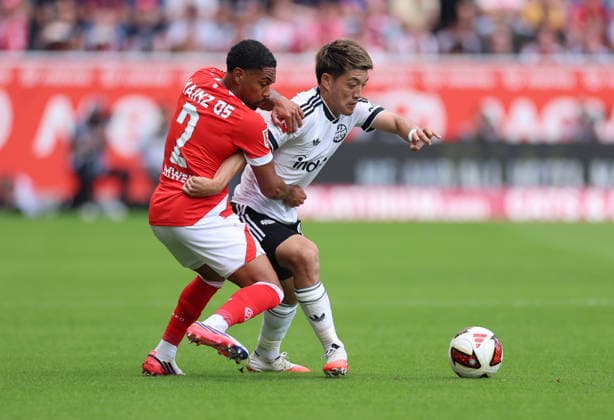12.09.2026, Fussball Bundesliga, 1. FSV Mainz 05 - Eintracht Frankfurt, v.l., Phillipp Mwene (FSV Mainz 05), Ritsu Doan (Eintracht Frankfurt) DFL DFB REGULATIONS PROHIBIT ANY USE OF PHOTOGRAPHS AS IMAGE SEQUENCES AND OR QUASI-VIDEO. xdcx *** September 12, 2026, Bundesliga, 1 FSV Mainz 05 vs. Eintracht Frankfurt, from left: Phillipp Mwene (FSV Mainz 05), Ritsu Doan (Eintracht Frankfurt). DFL and DFB regulations prohibit any use of photographs as image sequences and or quasi-video. xdcx Copyright: HMBxMedia Claus