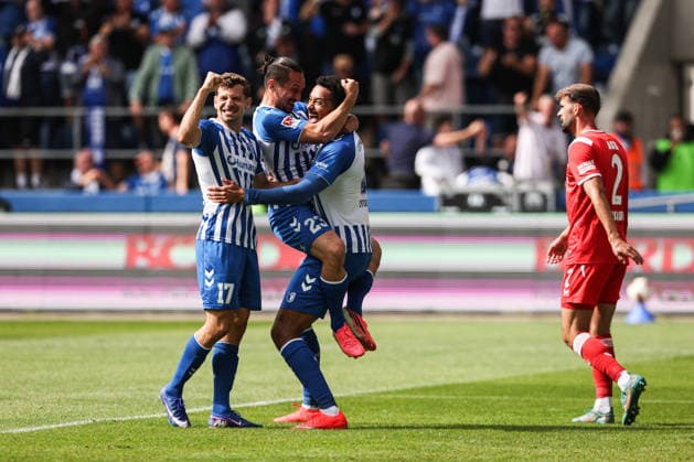 Torjubel - Torschütze Emmanuel Iyoha (1. FC Magdeburg,8) trifft zum 1-0 mit Baris Atik (1. FC Magdeburg,23) und Alexander Nollenberger (1. FC Magdeburg,17) - 2. Fußball Bundesliga Saison 2026-2027 1. FC Magdeburg vs 1. FC Kaiserslautern in der Avnet Arena in Magdeburg - Aktion,Fußball,Mann,Männer,Deutschland,12.09.2026 *** Goal celebration: Goal scorer Emmanuel Iyoha (1 FC Magdeburg, 8) scores the 1-0 goal with Baris Atik (1 FC Magdeburg, 23) and Alexander Nollenberger (1 FC Magdeburg,17, 2026–2027 Bundesliga season: 1 FC Magdeburg vs. 1 FC Kaiserslautern at the Avnet Arena in Magdeburg; action, soccer, man, men, Germany, September 12, 2026