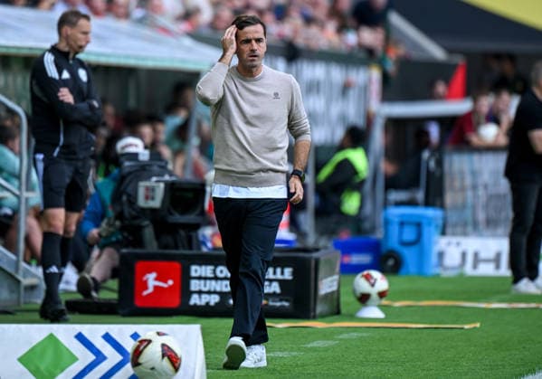 12.09.2026, xemx, Fussball 1.Bundesliga, FC Augsburg - Bayer 04 Leverkusen v.l. Cheftrainer Carles Martinez (Bayer 04 Leverkusen) nachdenklich, gruebelnd (DFL DFB REGULATIONS PROHIBIT ANY USE OF PHOTOGRAPHS as IMAGE SEQUENCES and or QUASI-VIDEO) Augsburg *** September 12, 2026, xemx, Soccer, Bundesliga 1, FC Augsburg vs. Bayer 04 Leverkusen: Head Coach Carles Martinez of Bayer 04 Leverkusen looking pensive, deep in thought. DFL and DFB regulations prohibit any use of photographs as image sequences and or quasi-video. Augsburg