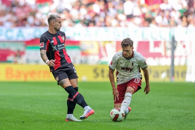 Zweikampf, Aleix Garcia (Bayer 04 Leverkusen, 24) mit Robin Fellhauer (FC Augsburg, 19), GER, FC Augsburg vs. Bayer 04 Leverkusen, Fussball, Bundesliga, 3. Spieltag, Saison 2026 2027, 12.09.2026, DFL DFB REGULATIONS PROHIBIT ANY USE OF PHOTOGRAPHS as IMAGE SEQUENCES and or QUASI-VIDEO, GER, FC Augsburg vs. Bayer 04 Leverkusen, Fussball, Bundesliga, 3. Spieltag, Saison 2026 2027, 12.09.2026 Augsburg *** Tackle between Aleix Garcia (Bayer 04 Leverkusen, 24) and Robin Fellhauer (FC Augsburg, 19), GER, FC Augsburg vs. Bayer 04 Leverkusen, Soccer, Bundesliga, Matchday 3, 2026–2027 Season, September 12, 2026, DFL and DFB regulations prohibit any use of photographs as image sequences and or quasi-video, GER, FC Augsburg vs. Bayer 04 Leverkusen, soccer, Bundesliga, Matchday 3, 2026–2027 season, September 12, 2026, Augsburg Copyright: xEibner-Pressefoto JennixMaulx EP_JML
