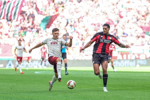 Zweikampf, Robin Fellhauer (FC Augsburg, 19) mit Christian Kofane (Bayer 04 Leverkusen, 35), GER, FC Augsburg vs. Bayer 04 Leverkusen, Fussball, Bundesliga, 3. Spieltag, Saison 2026 2027, 12.09.2026, DFL DFB REGULATIONS PROHIBIT ANY USE OF PHOTOGRAPHS as IMAGE SEQUENCES and or QUASI-VIDEO, GER, FC Augsburg vs. Bayer 04 Leverkusen, Fussball, Bundesliga, 3. Spieltag, Saison 2026 2027, 12.09.2026 Augsburg *** Tackle, Robin Fellhauer (FC Augsburg, 19) vs. Christian Kofane (Bayer 04 Leverkusen, 35), GER, FC Augsburg vs. Bayer 04 Leverkusen, Soccer, Bundesliga, Matchday 3, 2026–2027 Season, September 12, 2026, DFL and DFB regulations prohibit any use of photographs as image sequences and or quasi-video, GER, FC Augsburg vs. Bayer 04 Leverkusen, soccer, Bundesliga, Matchday 3, 2026–2027 season, September 12, 2026, Augsburg Copyright: xEibner-Pressefoto JennixMaulx EP_JML