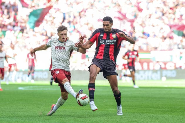 Zweikampf, Robin Fellhauer (FC Augsburg, 19) mit Christian Kofane (Bayer 04 Leverkusen, 35), GER, FC Augsburg vs. Bayer 04 Leverkusen, Fussball, Bundesliga, 3. Spieltag, Saison 2026 2027, 12.09.2026, DFL DFB REGULATIONS PROHIBIT ANY USE OF PHOTOGRAPHS as IMAGE SEQUENCES and or QUASI-VIDEO, GER, FC Augsburg vs. Bayer 04 Leverkusen, Fussball, Bundesliga, 3. Spieltag, Saison 2026 2027, 12.09.2026 Augsburg *** Tackle, Robin Fellhauer (FC Augsburg, 19) vs. Christian Kofane (Bayer 04 Leverkusen, 35), GER, FC Augsburg vs. Bayer 04 Leverkusen, Soccer, Bundesliga, Matchday 3, 2026–2027 Season, September 12, 2026, DFL and DFB regulations prohibit any use of photographs as image sequences and or quasi-video, GER, FC Augsburg vs. Bayer 04 Leverkusen, soccer, Bundesliga, Matchday 3, 2026–2027 season, September 12, 2026, Augsburg Copyright: xEibner-Pressefoto JennixMaulx EP_JML