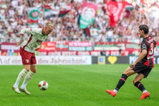 Marius Wolf (FC Augsburg, 27) mit Miguel Gutierrez (Bayer 04 Leverkusen, 03), GER, FC Augsburg vs. Bayer 04 Leverkusen, Fussball, Bundesliga, 3. Spieltag, Saison 2026 2027, 12.09.2026, DFL DFB REGULATIONS PROHIBIT ANY USE OF PHOTOGRAPHS as IMAGE SEQUENCES and or QUASI-VIDEO, GER, FC Augsburg vs. Bayer 04 Leverkusen, Fussball, Bundesliga, 3. Spieltag, Saison 2026 2027, 12.09.2026 Augsburg *** Marius Wolf (FC Augsburg), 27, with Miguel Gutierrez (Bayer 04 Leverkusen), 03, GER; FC Augsburg vs. Bayer 04 Leverkusen, Soccer, Bundesliga, Matchday 3, 2026–2027 Season, September 12, 2026, DFL and DFB regulations prohibit any use of photographs as image sequences and or quasi-video, GER, FC Augsburg vs. Bayer 04 Leverkusen, soccer, Bundesliga, Matchday 3, 2026–2027 season, September 12, 2026, Augsburg Copyright: xEibner-Pressefoto JennixMaulx EP_JML
