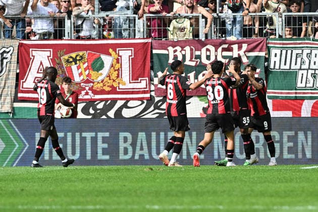 1. Fussball Bundesliga: FC Augsburg - Bayer 04 Leverkusen, 12.09.2026 AUGSBURG, GERMANY; 12. SEPTEMBER: Jubel der Gäste nach dem Treffer zum 0-1 durch Christian KOFANE (Bayer Leverkusen 35) Tor Torschuetze Freude Happy während dem Match der Bundesliga zwischen dem FC Augsburg und Bayer 04 Leverkusen am 3. Spieltag in der WWK-Arena DFL REGULATIONS PROHIBIT ANY USE OF PHOTOGRAPHS AS IMAGE SEQUENCES AND OR QUASI-VIDEO *** 1 Soccer Bundesliga FC Augsburg vs. Bayer 04 Leverkusen, September 12, 2026, AUGSBURG, GERMANY September 12: The visiting fans celebrate after Christian KOFANE scores the 0–1 goal for Bayer Leverkusen. Goal, goal scorer, joy, happy during the Bundesliga match between FC Augsburg and Bayer 04 Leverkusen on Matchday 3 at the WWK Arena. DFL REGULATIONS PROHIBIT ANY USE OF PHOTOGRAPHS AS IMAGE SEQUENCES AND OR QUASI-VIDEO Copyright: xBEAUTIFULxSPORTS Goldbergx
