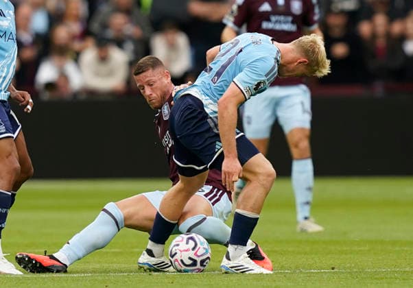 Birmingham, England, 12th September 2026. Ross Barkley of Aston Villa tackles Xaver Schlager of Nottingham Forest during the Aston Villa vs Nottingham Forest Premier League match at Villa Park, Birmingham. Picture credit should read: Andrew Yates Sportimage EDITORIAL USE ONLY. No use with unauthorised audio, video, data, fixture lists, club league logos or live services. Online in-match use limited to 120 images, no video emulation. No use in betting, games or single club league player publications. SPI_001_AY_Villa_Forest SPI-4990-0001