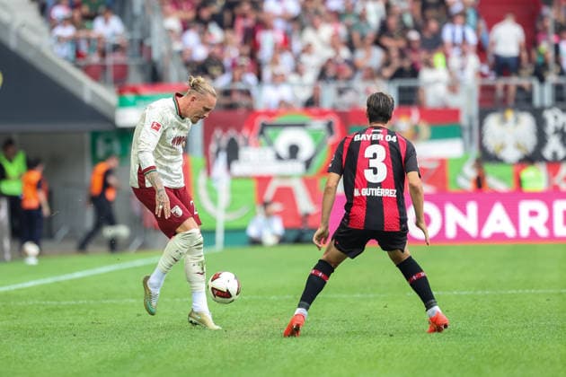 Marius Wolf (FC Augsburg, 27) mit Miguel Gutierrez (Bayer 04 Leverkusen, 03), GER, FC Augsburg vs. Bayer 04 Leverkusen, Fussball, Bundesliga, 3. Spieltag, Saison 2026 2027, 12.09.2026, DFL DFB REGULATIONS PROHIBIT ANY USE OF PHOTOGRAPHS as IMAGE SEQUENCES and or QUASI-VIDEO, GER, FC Augsburg vs. Bayer 04 Leverkusen, Fussball, Bundesliga, 3. Spieltag, Saison 2026 2027, 12.09.2026 Augsburg *** Marius Wolf (FC Augsburg), 27, with Miguel Gutierrez (Bayer 04 Leverkusen), 03, GER, FC Augsburg vs. Bayer 04 Leverkusen, Soccer, Bundesliga, Matchday 3, 2026–2027 Season, September 12, 2026, DFL and DFB regulations prohibit any use of photographs as image sequences and or quasi-video, GER, FC Augsburg vs. Bayer 04 Leverkusen, Soccer, Bundesliga, Matchday 3, 2026–2027 season, September 12, 2026, Augsburg Copyright: xEibner-Pressefoto JennixMaulx EP_JML