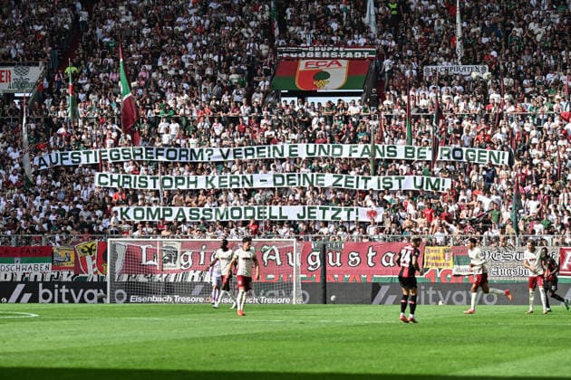 1. Fussball Bundesliga: FC Augsburg - Bayer 04 Leverkusen, 12.09.2026 AUGSBURG, GERMANY; 12. SEPTEMBER: Fans der Augsburger mit einer Botschaft an den BFV - Kompassmodell Jetzt - während dem Match der Bundesliga zwischen dem FC Augsburg und Bayer 04 Leverkusen am 3. Spieltag in der WWK-Arena DFL REGULATIONS PROHIBIT ANY USE OF PHOTOGRAPHS AS IMAGE SEQUENCES AND OR QUASI-VIDEO *** 1 Bundesliga: FC Augsburg vs. Bayer 04 Leverkusen, September 12, 2026, AUGSBURG, GERMANY SEPTEMBER 12 Augsburg fans with a message for the BFV Compass model Now during the Bundesliga match between FC Augsburg and Bayer 04 Leverkusen on Matchday 3 at the WWK Arena DFL REGULATIONS PROHIBIT ANY USE OF PHOTOGRAPHS AS IIMAGE SEQUENCES AND OR QUASI-VIDEO Copyright: xBEAUTIFULxSPORTS Goldbergx