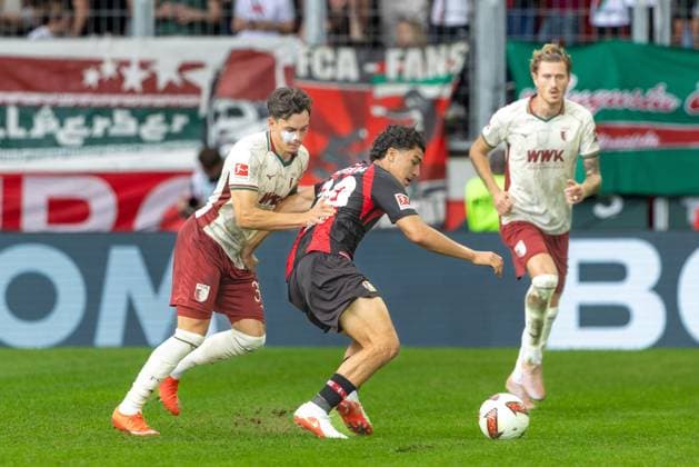 Fabian Rieder (FC Augsburg) und Ibrahim Maza (Bayer 04 Leverkusen) v-l im Zweikampf, FC Augsburg vs. Bayer 04 Leverkusen, Fußball-Bundesliga, Fussball, 1. Bundesliga, 03. Spieltag, 12.09.2026 DFB regulations prohibit any use of photographs as image sequences and or quasi-video *** Fabian Rieder (FC Augsburg) and Ibrahim Maza (Bayer 04 Leverkusen) in a one-on-one battle, FC Augsburg vs. Bayer 04 Leverkusen, Bundesliga Soccer, Soccer, Bundesliga 1, Matchday 3, September 12, 2026. DFB regulations prohibit any use of photographs as image sequences and or quasi-video. Copyright: xkolbert-press PeterxFastlx