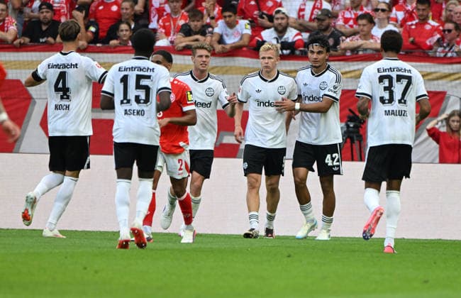 Fussball-Bundesliga - Saison 2026 2027 Mewa-Arena Mainz - 12.09.2026 1. FSV Mainz 05 (mz) - Eintracht Frankfurt (f) Jonathan BURKARDT (Eintracht Frankfurt), mi, erzielte das 2:0, re: Can UZUN (Eintracht Frankfurt) DFL REGULATIONS PROHIBIT ANY USE OF PHOTOGRAPHS AS IMAGE SEQUENCES AND OR QUASI VIDEO EDITORIAL USE ONLY NATIONAL AND INTERNATIONAL NEWS AGENCIES OUT Fussball-Bundesliga - 1. FSV Mainz 05 *** Soccer Bundesliga 2026–2027 Season, Mewa Arena, Mainz, September 12, 2026, 1:00 p.m. FSV Mainz 05 vs. Eintracht Frankfurt. Jonathan BURKARDT of Eintracht Frankfurt (center) scored the 2–0 goal, re Can UZUN Eintracht Frankfurt DFL regulations prohibit any use of photographs as image sequences and or quasi-video; editorial use only; national and international news agencies excluded. German Bundesliga 1 FSV Mainz 05