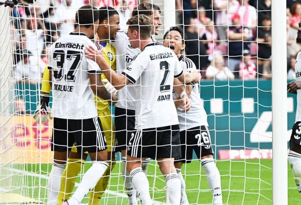 Fussball-Bundesliga - Saison 2026 2027 Mewa-Arena Mainz - 12.09.2026 1. FSV Mainz 05 (mz) - Eintracht Frankfurt (f) Jubeltraube um Torwart Noah ATUBOLU (Eintracht Frankfurt), der einen 11-Meter von Nadiem AMIRI(1. FSV Mainz 05) gehalten hat DFL REGULATIONS PROHIBIT ANY USE OF PHOTOGRAPHS AS IMAGE SEQUENCES AND OR QUASI VIDEO EDITORIAL USE ONLY NATIONAL AND INTERNATIONAL NEWS AGENCIES OUT Fussball-Bundesliga - 1. FSV Mainz 05 *** Soccer Bundesliga Season 2026–2027, Mewa Arena, Mainz, September 12, 2026, 1 FSV Mainz 05 vs. Eintracht Frankfurt: A group of players celebrating around goalkeeper Noah ATUBOLU of Eintracht Frankfurt, who saved an 11-meter penalty kick by Nadiem AMIRI of 1. FSV Mainz 05. DFL regulations prohibit any use of photographs as image sequences and or quasi-video; editorial use only by national and international news agencies OUT: German Bundesliga 1 FSV Mainz 05