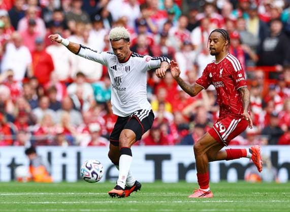 Antonee Robinson of Fulham and Bradley Barcola of Liverpool Liverpool v Fulham, Premier League, Football, Football, Anfield, Liverpool, UK - 12 Sep 2026Liverpool Anfield United Kingdom EDITORIAL USE ONLY No use with unauthorised audio, video, data, fixture lists, club league logos or live services. Online in-match use limited to 120 images, no video emulation. No use in betting, games or single club league player publications.  Copyright: xMattxWest Shutterstockx 17144551aw