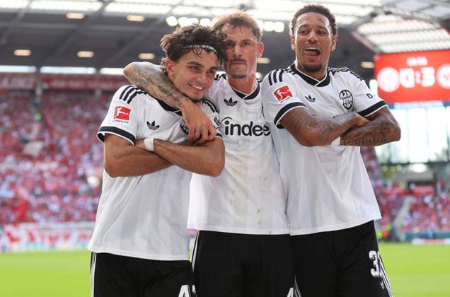 12.09.2026, Fussball Bundesliga, 1. FSV Mainz 05 - Eintracht Frankfurt, v.l., Torjubel zum 0:3 durch Can Uzun (Eintracht Frankfurt), Goal celebration, celebrate the goal, Robin Koch (Eintracht Frankfurt), Jeremiaha Maluze (Eintracht Frankfurt) DFL DFB REGULATIONS PROHIBIT ANY USE OF PHOTOGRAPHS AS IMAGE SEQUENCES AND OR QUASI-VIDEO. xdcx *** September 12, 2026, Bundesliga, 1. FSV Mainz 05 vs. Eintracht Frankfurt, from left, goal celebration after Can Uzun (Eintracht Frankfurt) scores the 0-3 goal, goal celebration, celebrating the goal, Robin Koch, Eintracht Frankfurt; Jeremiaha Maluze, Eintracht Frankfurt. DFL and DFB regulations prohibit any use of photographs as image sequences and or quasi-video. xdcx Copyright: HMBxMedia Claus