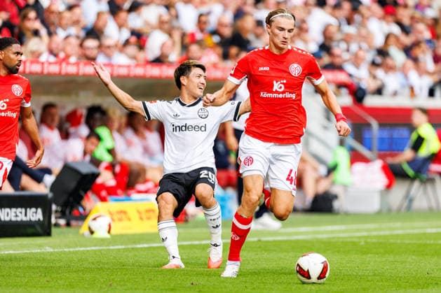 MAINZ, GERMANY - SEPTEMBER 12: Ritsu Doan (Eintracht Frankfurt, 20) and Kacper Potulski (1. FSV Mainz 05, 48) during the Bundesliga match between 1. FSV Mainz 05 vs. Eintracht Frankfurt at MEWA Arena on matchday 3 of the 1. Bundesliga on September 12, 2026 in Mainz, Germany. DFL REGULATIONS PROHIBIT ANY USE OF PHOTOGRAPHS AS IMAGE SEQUENCES AND OR QUASI-VIDEO. Rhineland-Palatinate Germany Copyright: xStephanxHahnex