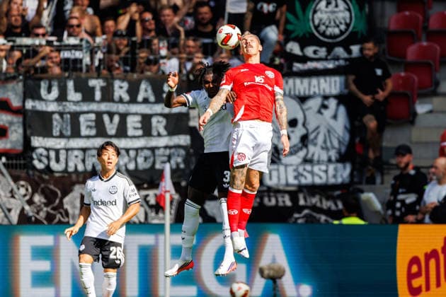 MAINZ, GERMANY - SEPTEMBER 12: Lilian Brassier (Eintracht Frankfurt, 3) and Nadiem Amiri (1. FSV Mainz 05, 10) compete for the ball in the air during the Bundesliga match between 1. FSV Mainz 05 vs. Eintracht Frankfurt at MEWA Arena on matchday 3 of the 1. Bundesliga on September 12, 2026 in Mainz, Germany. DFL REGULATIONS PROHIBIT ANY USE OF PHOTOGRAPHS AS IMAGE SEQUENCES AND OR QUASI-VIDEO. Rhineland-Palatinate Germany Copyright: xStephanxHahnex