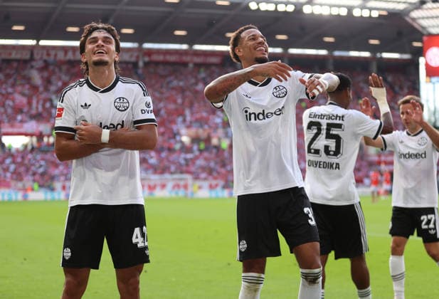 12.09.2026, Fussball Bundesliga, 1. FSV Mainz 05 - Eintracht Frankfurt, v.l., Torjubel zum 0:3 durch Can Uzun (Eintracht Frankfurt), Goal celebration, celebrate the goal, Jeremiaha Maluze (Eintracht Frankfurt) DFL DFB REGULATIONS PROHIBIT ANY USE OF PHOTOGRAPHS AS IMAGE SEQUENCES AND OR QUASI-VIDEO. xdcx *** September 12, 2026, Bundesliga Soccer, 1. FSV Mainz 05 vs. Eintracht Frankfurt, from left, goal celebration after Eintracht Frankfurt’s 3-0 lead by Can Uzun, goal celebration, celebrating the goal, Jeremiaha Maluze, Eintracht Frankfurt. DFL and DFB regulations prohibit any use of photographs as image sequences and or quasi-video. xdcx Copyright: HMBxMedia Claus