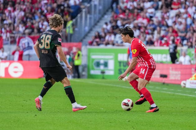 1. Bundesliga: SC Freiburg vs Borussia Mönchengladbach, 12.09.2026 Zweikampf zwischen Iaia Danfa (Borussia Mönchengladbach, 39) und Yuito Suzuki (SC Freiburg, 14) 1. Bundesliga: SC Freiburg vs Borussia Mönchengladbach, Europa-Park-Stadion, 12.09.2026 DFB DFL REGULATIONS PROHIBIT ANY USE OF PHOTOGRAPHS AS IMAGE SEQUENCES AND OR QUASI-VIDEO. *** 1 Bundesliga: SC Freiburg vs. Borussia Mönchengladbach, September 12, 2026. A tackle between Iaia Danfa of Borussia Mönchengladbach (No. 39) and Yuito Suzuki of SC Freiburg (No. 14). 1 Bundesliga: SC Freiburg vs. Borussia Mönchengladbach, Europa-Park Stadium, September 12, 2026 DFB and DFL regulations prohibit any use of photographs as image sequences and or quasi-video. Copyright: xBEAUTIFULxSPORTS Boscox