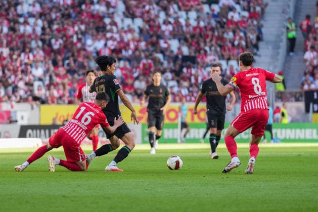 1. Bundesliga: SC Freiburg vs Borussia Mönchengladbach, 12.09.2026 Zweikampf zwischen Yannik Engelhardt (SC Freiburg, 16) und ShÅ«to Machino (Borussia Mönchengladbach, 18) 1. Bundesliga: SC Freiburg vs Borussia Mönchengladbach, Europa-Park-Stadion, 12.09.2026 DFB DFL REGULATIONS PROHIBIT ANY USE OF PHOTOGRAPHS AS IMAGE SEQUENCES AND OR QUASI-VIDEO. *** 1 Bundesliga: SC Freiburg vs. Borussia Mönchengladbach, September 12, 2026: A tackle between Yannik Engelhardt (SC Freiburg, 16) and Shuto Machino (Borussia Mönchengladbach, 18), Bundesliga Match 1: SC Freiburg vs. Borussia Mönchengladbach, Europa-Park Stadium, September 12, 2026 DFB and DFL regulations prohibit any use of photographs as image sequences and or quasi-video. Copyright: xBEAUTIFULxSPORTS Boscox